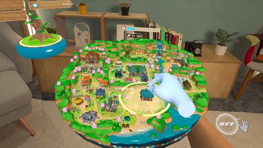Capture de Story of Seasons: Your Wonderful Life en réalité mixte, main virtuelle au-dessus de la maquette du village