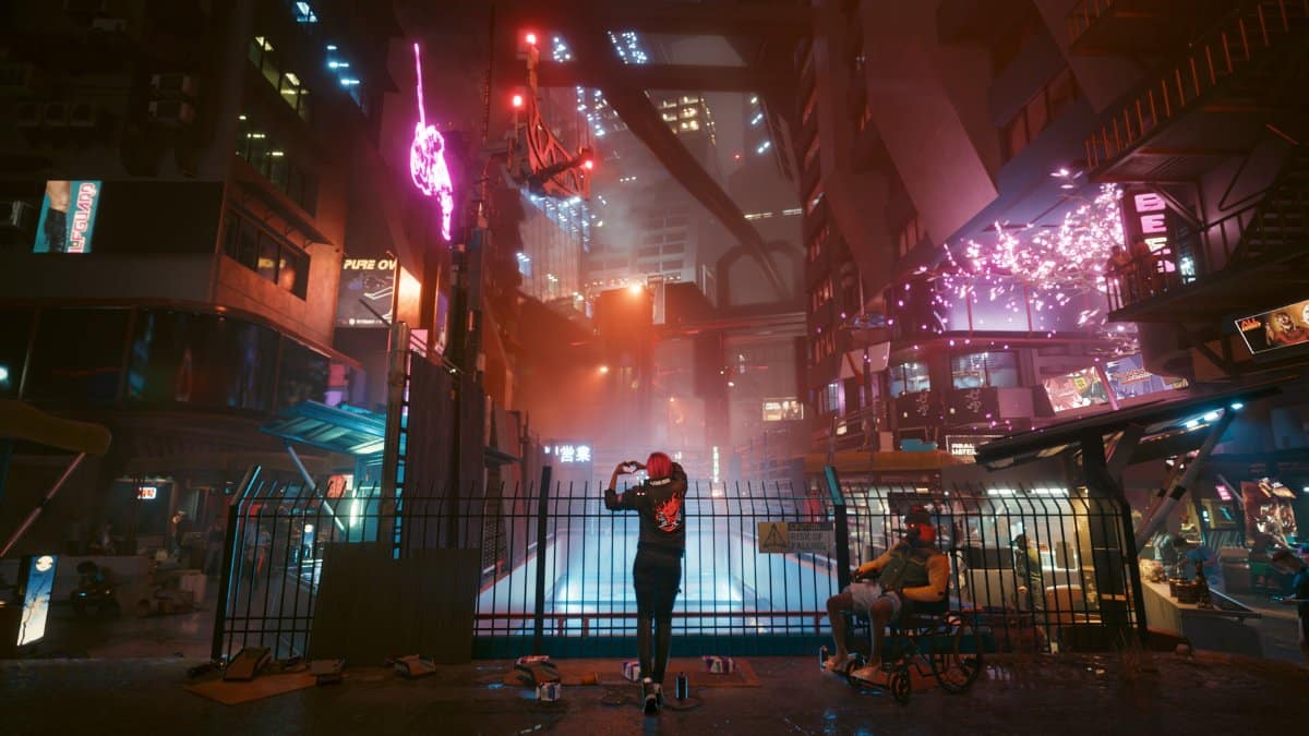 Une rue de Night City sous les néons, dans Cyberpunk 2077